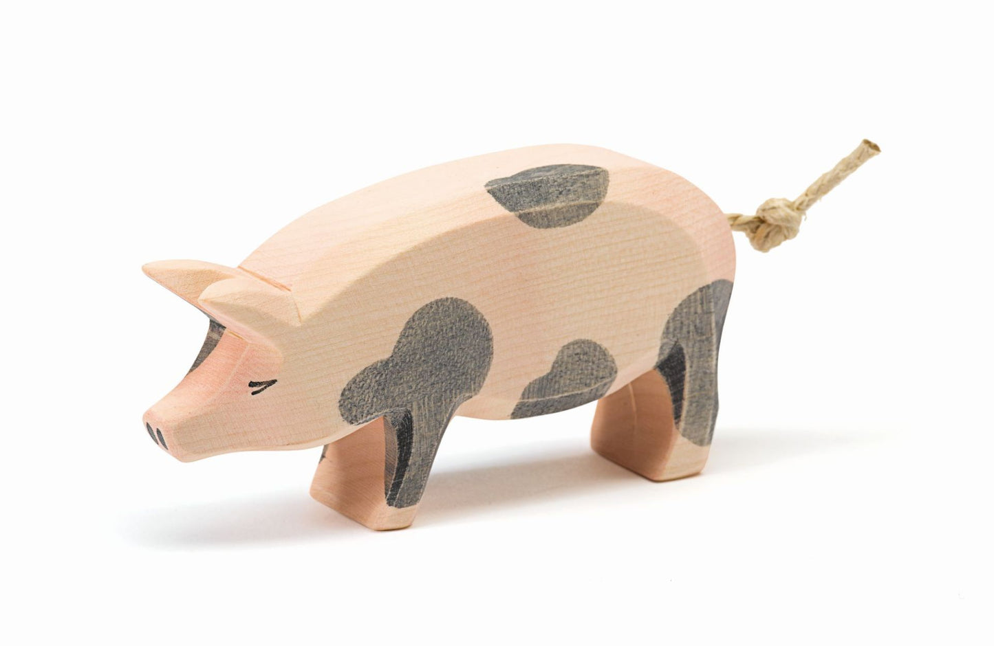 Spotted pig with head held high by Ostheimer