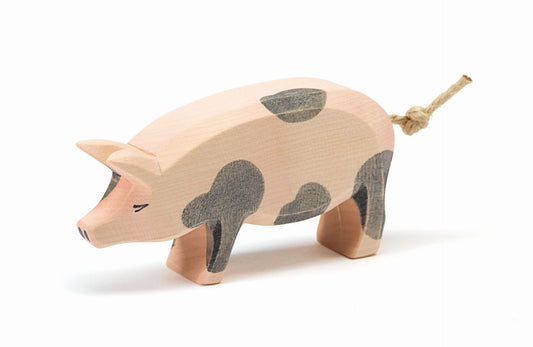 Spotted pig with head held high by Ostheimer