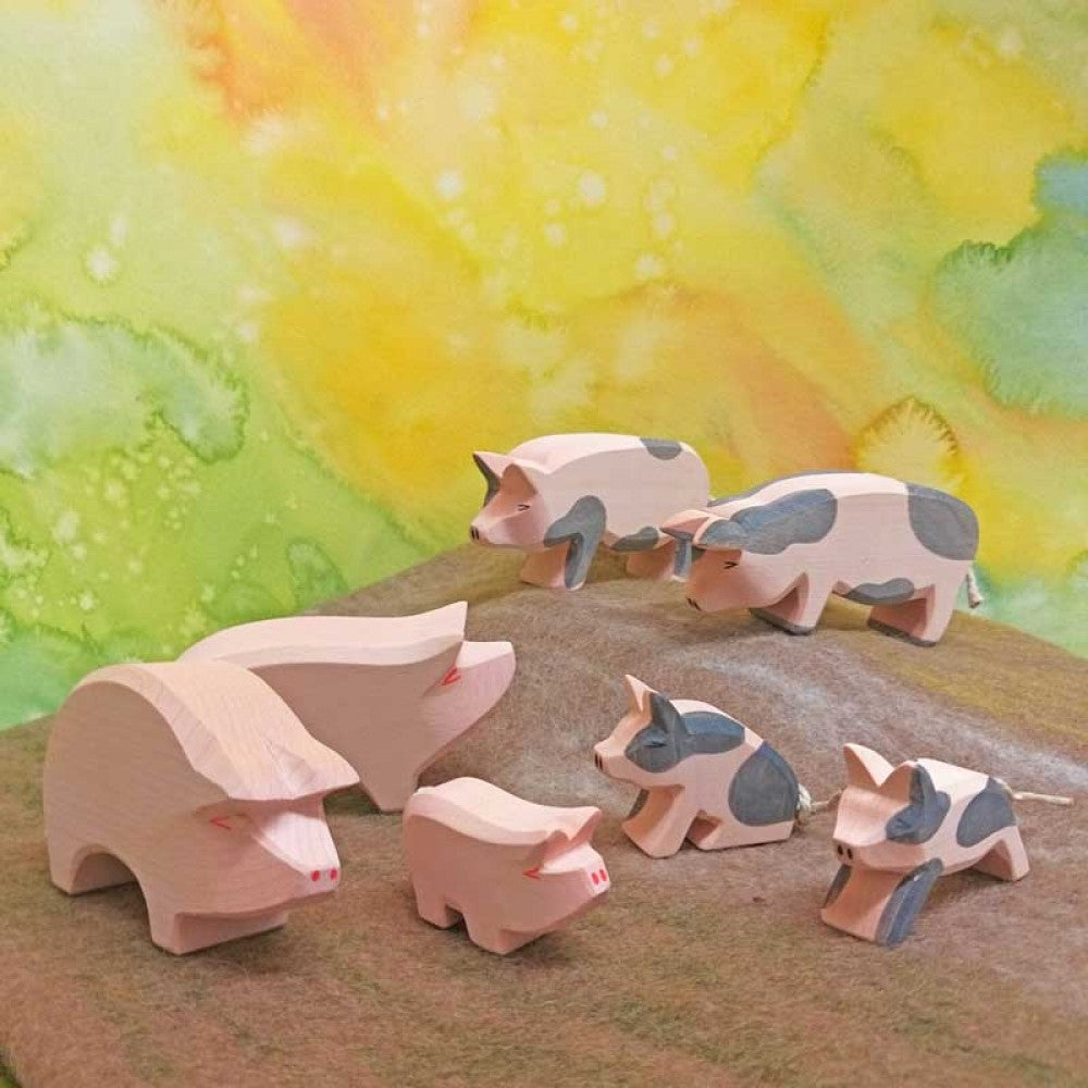 Spotted pig with head held high by Ostheimer